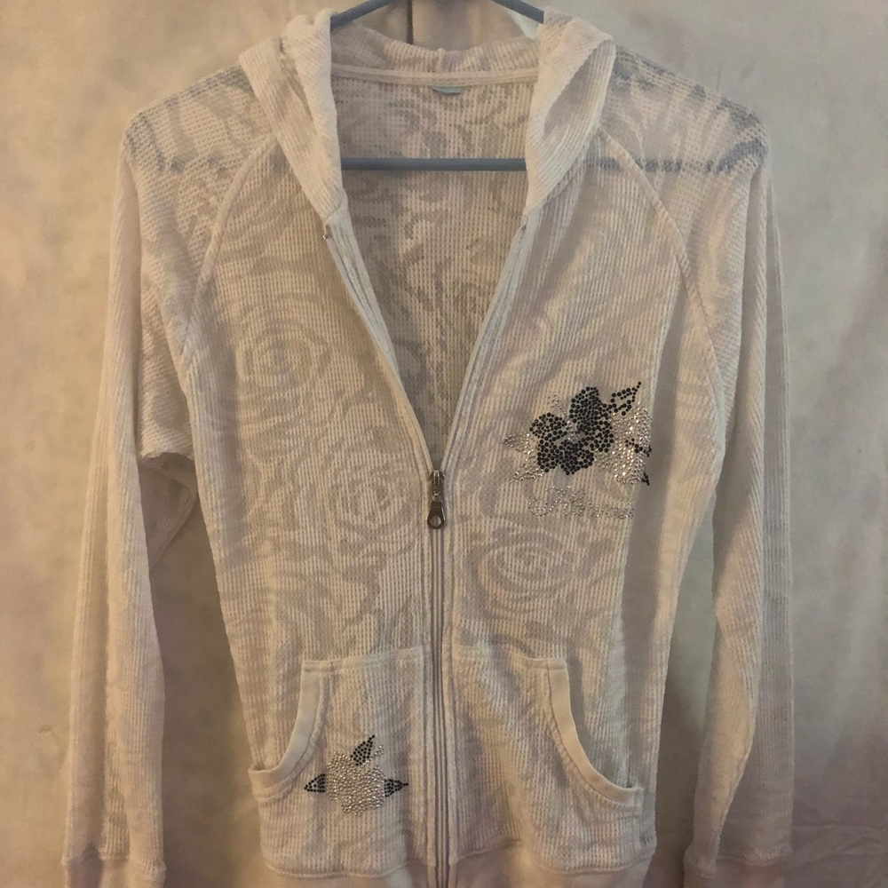 White light jacket with Hawaiian print on front.
